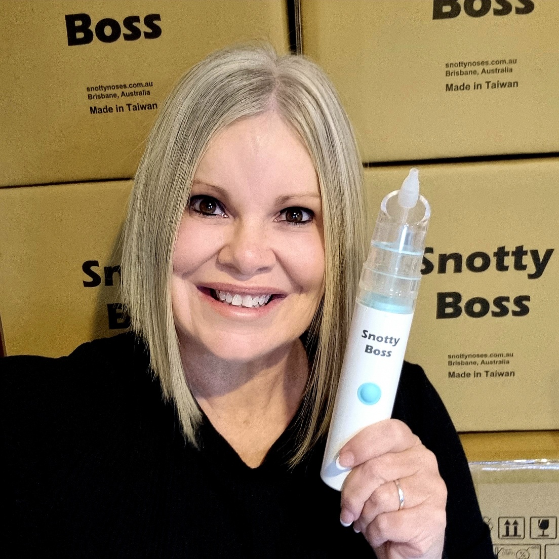 Laura, Founder holding Snotty Boss 