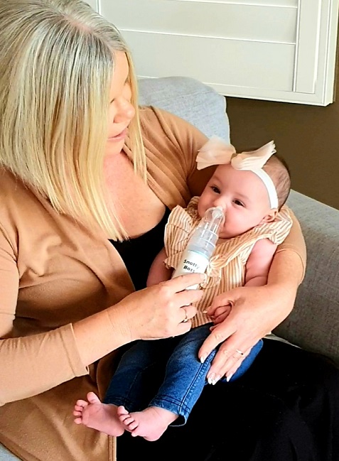 How to hold a baby when you use a nasal aspirator
